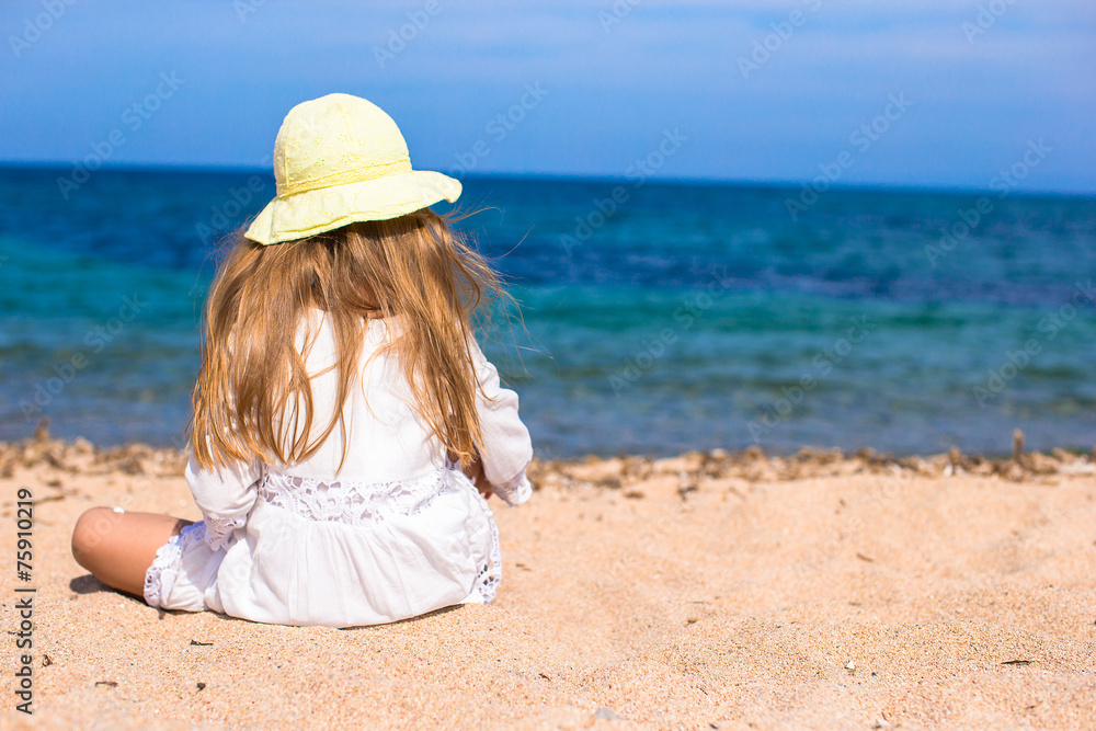 Adorable little girl at tropical beach during vacation Adorable little girl at tropical beach during vacation