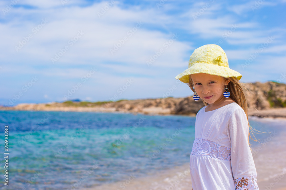 Adorable little girl at tropical beach during vacation Adorable little girl at tropical beach during vacation
