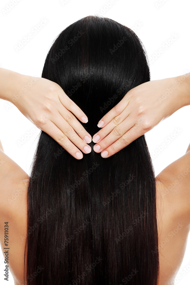Brunette woman touching her hair Brunette woman touching her hair