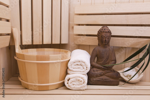 buddha statue and zen stones in sauna