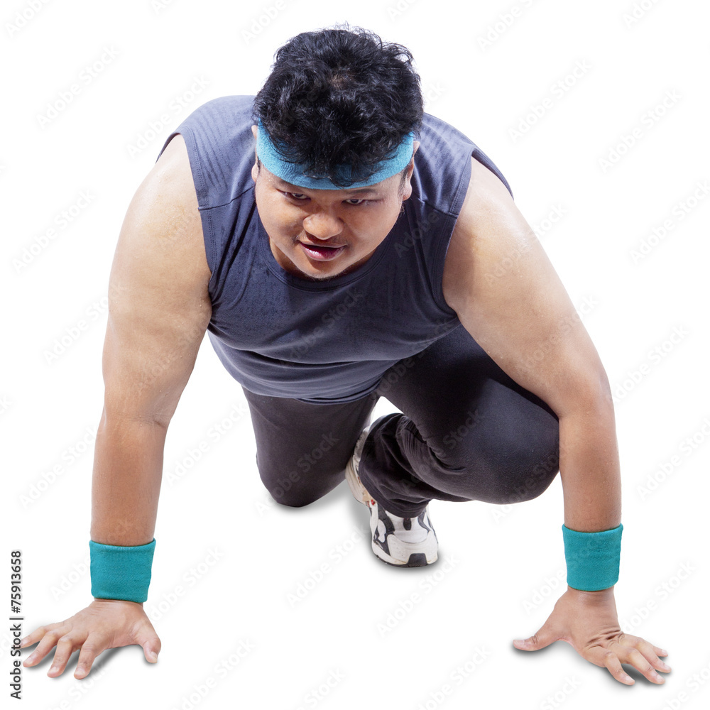 Fat person in ready position to run Fat person in ready position to run
