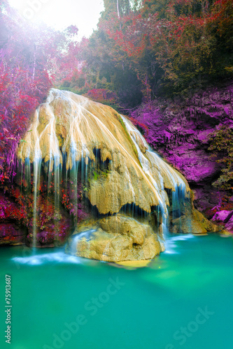wonderful waterfall with colorful tree in thailand