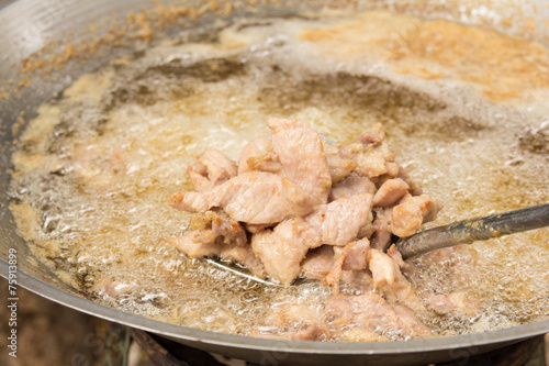 Deep frying pork in hot oil  - thai style photo