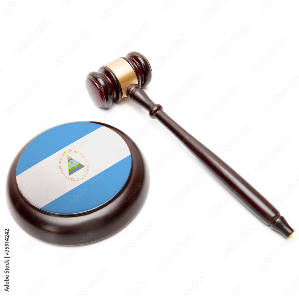 Judge gavel and soundboard with national flag on it - Nicaragua