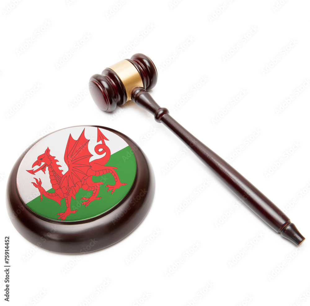 Judge gavel and soundboard with national flag on it - Wales