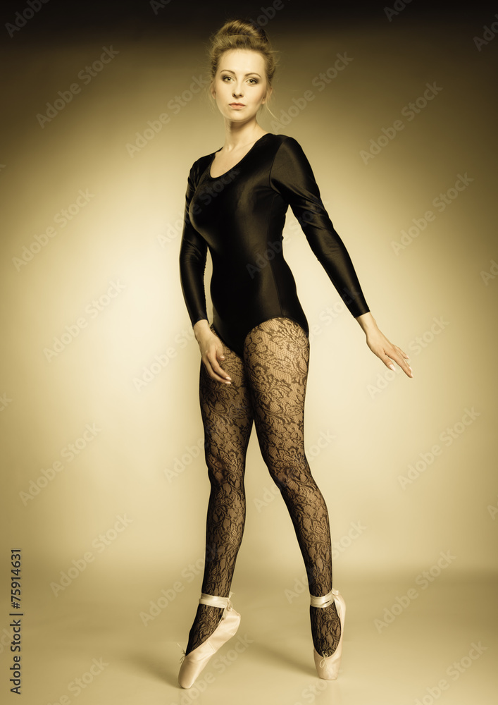 Graceful woman ballet dancer full length