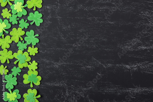 Green Clover on Chalkboard Background Background for St. Patrick
