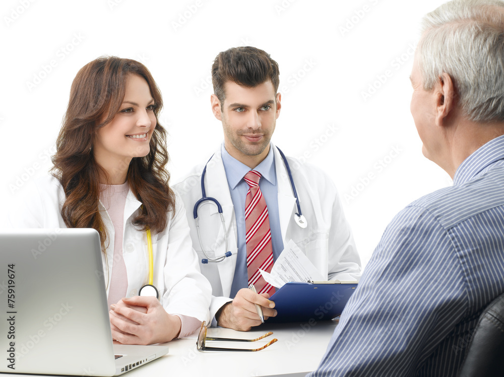 Medical discussion at hospital with elderly patient Medical discussion at hospital with elderly patient