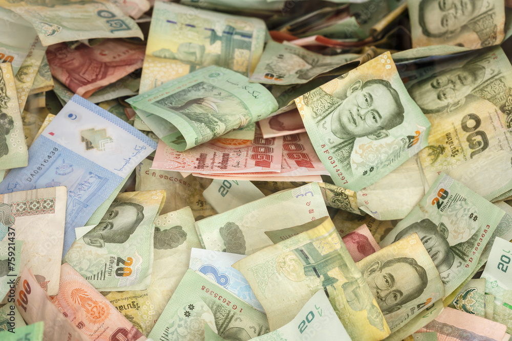 Obraz premium Stack of Thai money in donation box