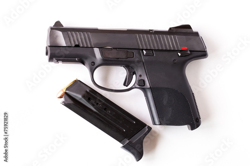 Isolated gun and magazine against white background