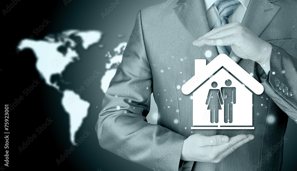 businessman protecting family in home with hands businessman protecting family in home with hands