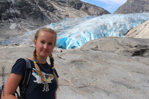 Young woman on the Nigardsbreen. Travel Norway. photo