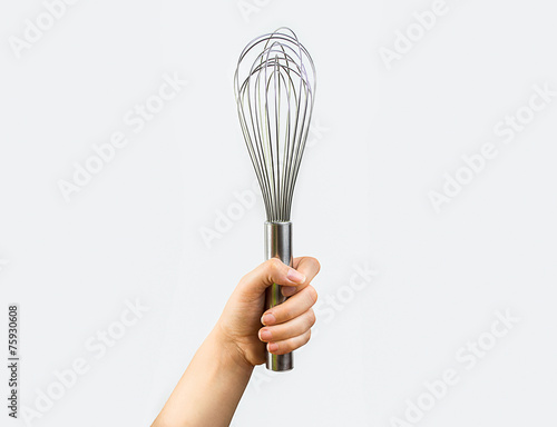 Fotografie hand holding a whisk