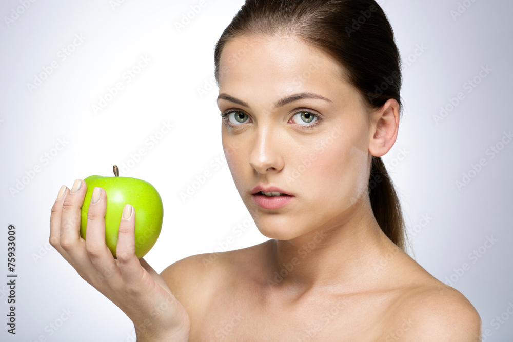 Portrait of a young beautiful girl with green apple Portrait of a young beautiful girl with green apple