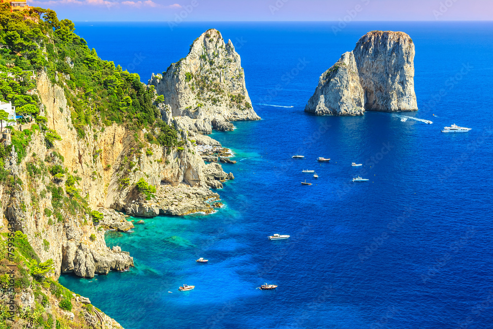 Capri island,beach and Faraglioni cliffs,Italy,Europe