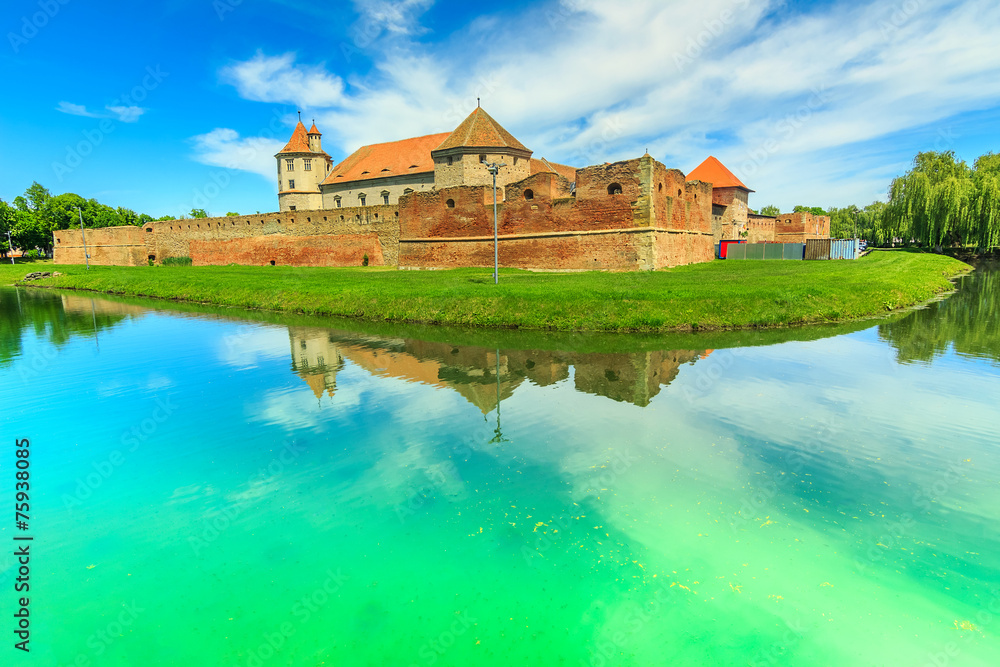 Fagaras fortress and clear lake in Transylvania,Romania,Europe