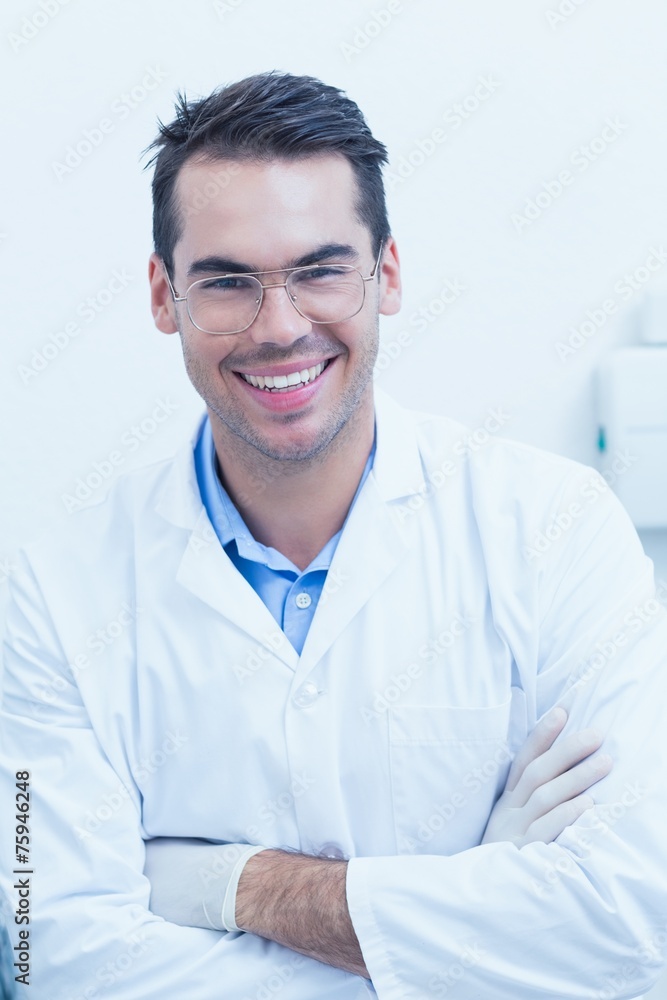 Happy male dentist with arms crossed Happy male dentist with arms crossed