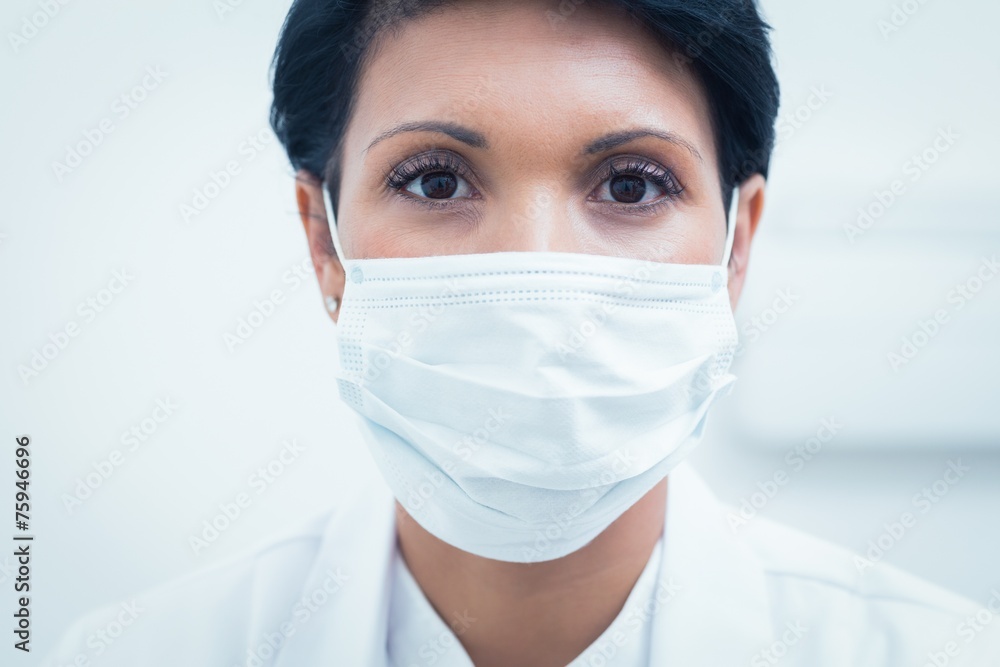 Female dentist wearing surgical mask Female dentist wearing surgical mask