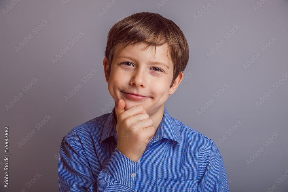 teenager boy 10 years of European appearance thinks smiling d teenager boy 10 years of European appearance thinks smiling d