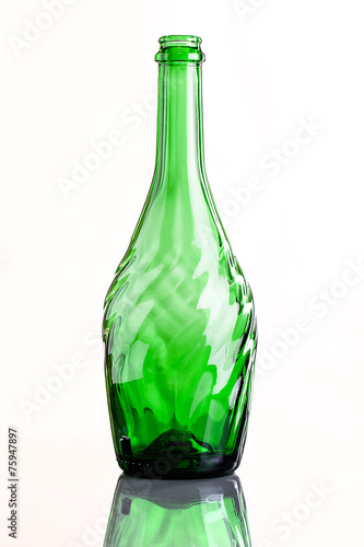 empty carved glass bottle with reflection
