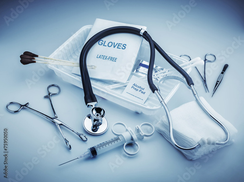 Medical instruments for ENT doctor on pale blue