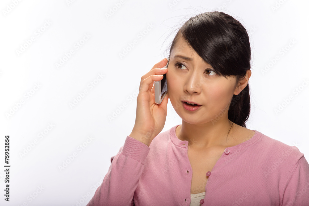 Young Asian woman talking on cellphone Young Asian woman talking on cellphone