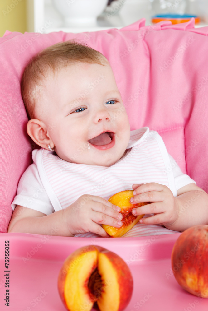 Happy little girl eating fruit Happy little girl eating fruit