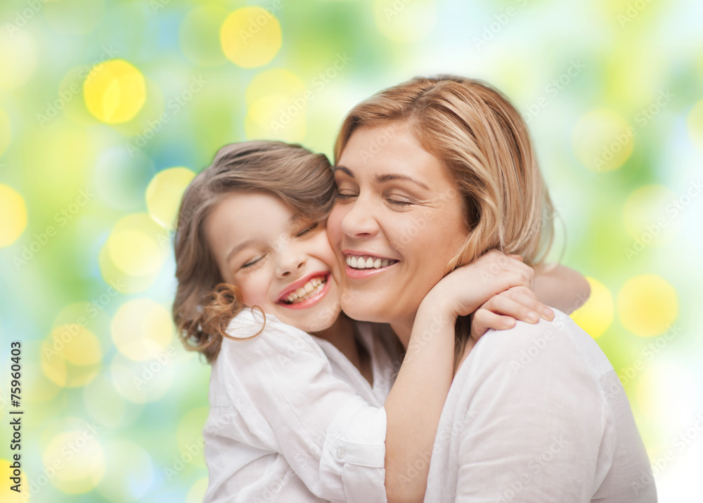 happy mother and daughter hugging happy mother and daughter hugging