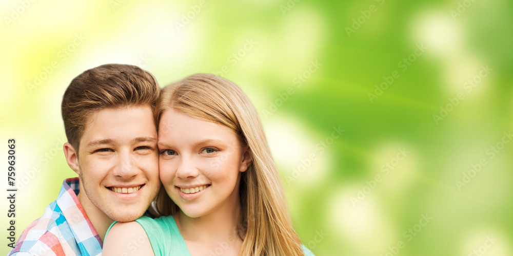smiling couple hugging over green background smiling couple hugging over green background