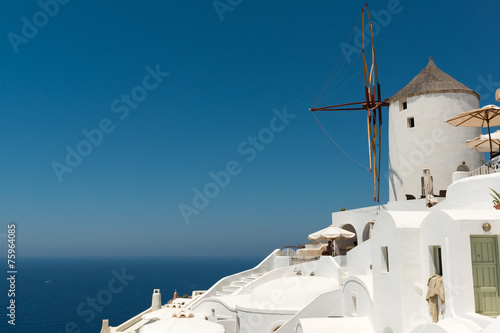 Windmill and traditional houses of Oia in Santorini