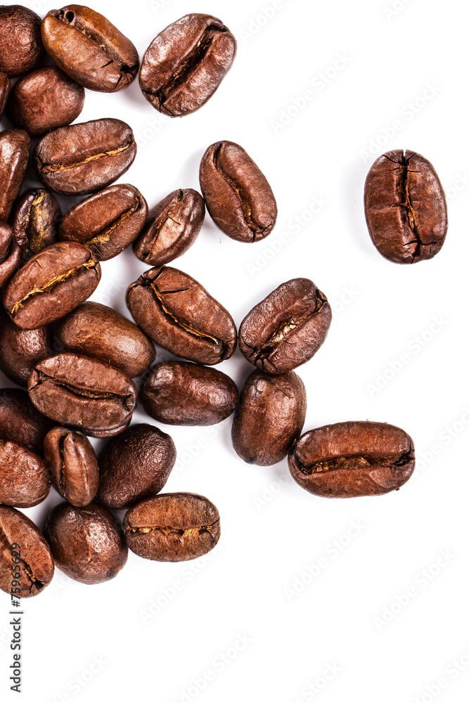Brown coffee beans isolated on white background macro. Roasted C Brown coffee beans isolated on white background macro. Roasted C