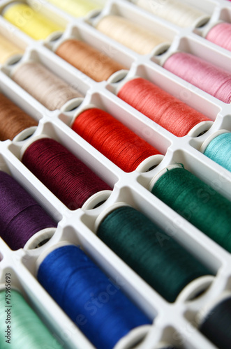 Multicolored sewing threads background