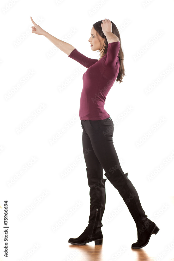 confused young woman pointing a finger in the blank confused young woman pointing a finger in the blank