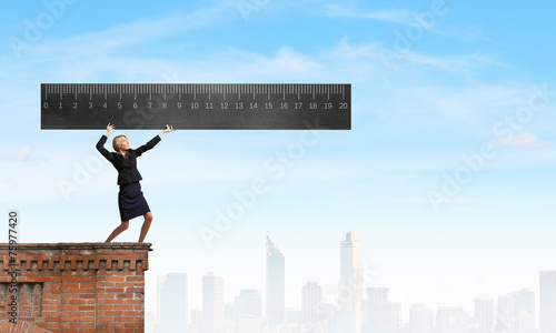 Woman with huge ruler