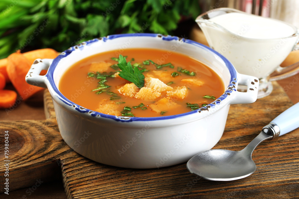 Composition with carrot soup, ingredients and herbs Composition with carrot soup, ingredients and herbs