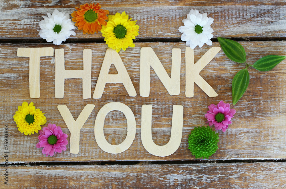 Thank you written with wooden letters and santini flowers