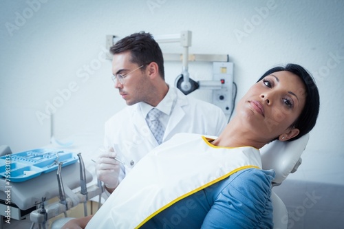 Serious woman waiting for dental exam