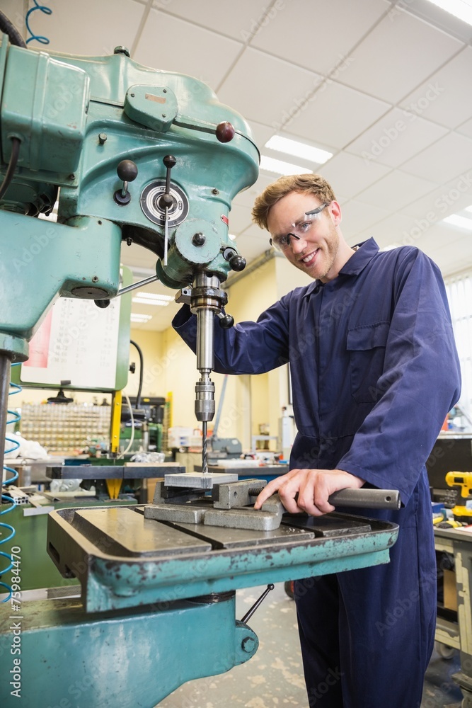 Engineering student using large drill Engineering student using large drill