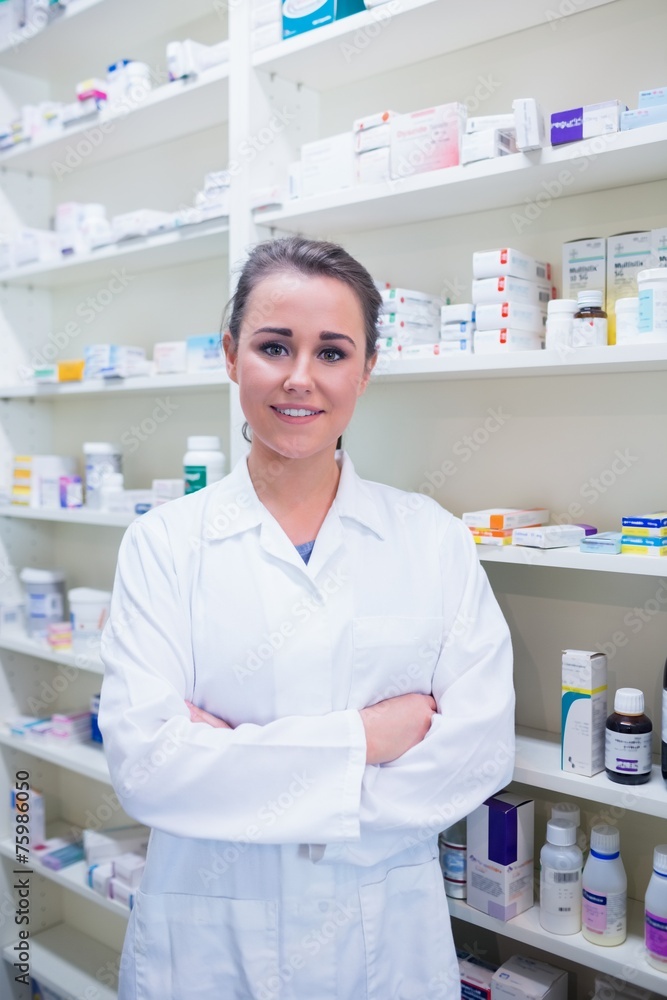 Portrait of a smiling student in lab coat with arms crossed Portrait of a smiling student in lab coat with arms crossed