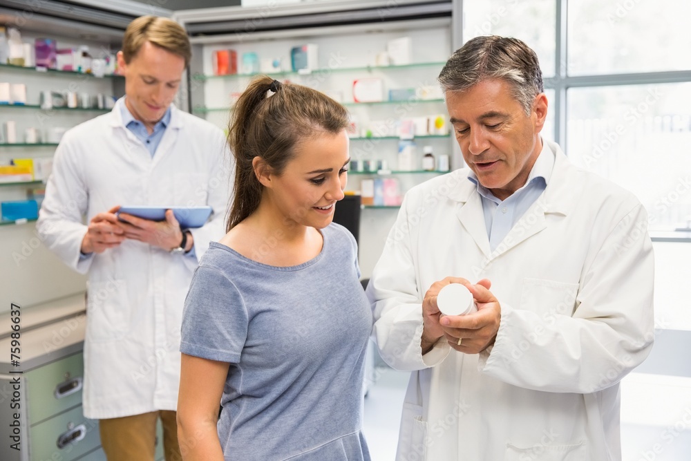 Happy customer talking with pharmacist Happy customer talking with pharmacist