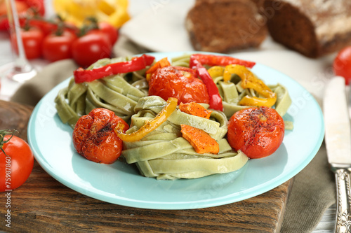 Tasty pasta with pepper, carrot and tomatoes