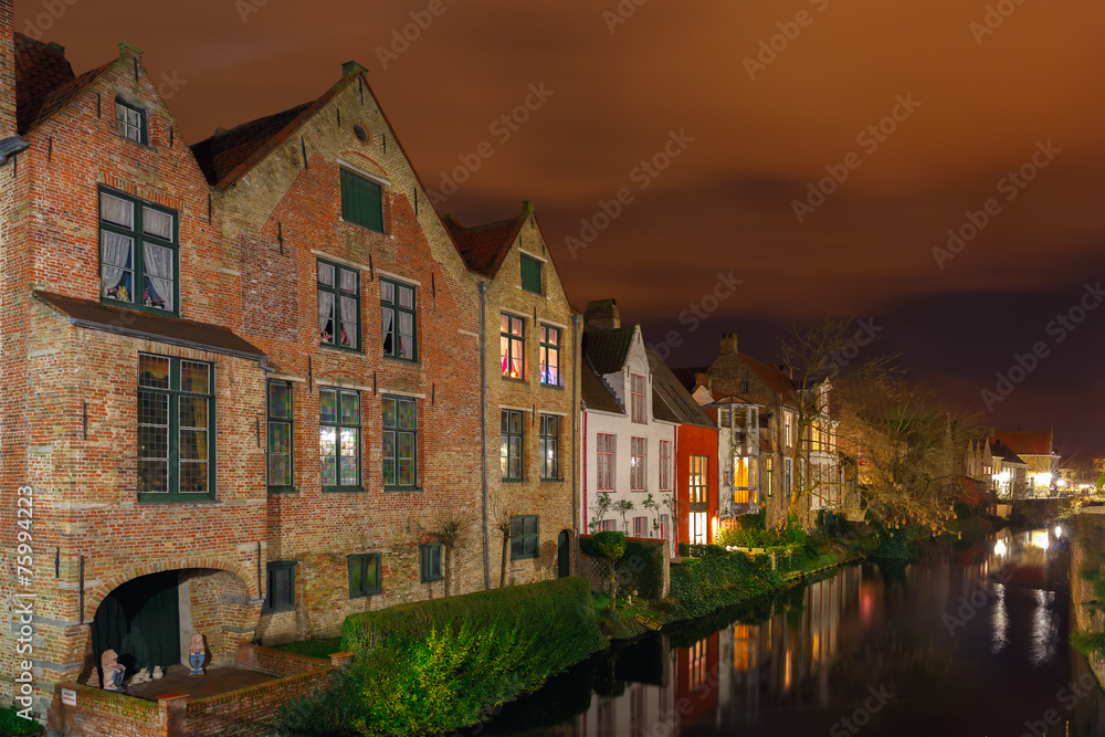 Cityscape with the picturesque night canal in Bruges