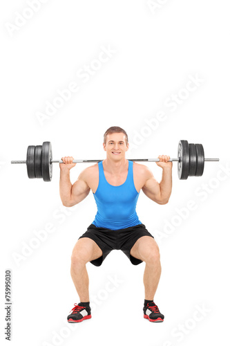Strong man exercising with a barbell