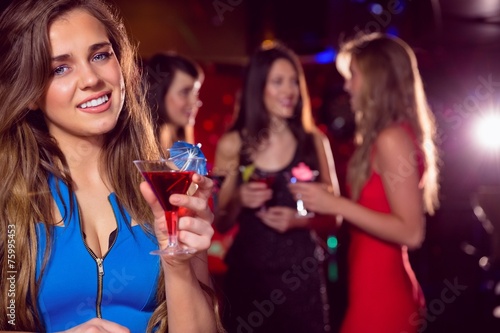 Pretty blonde drinking a cocktail