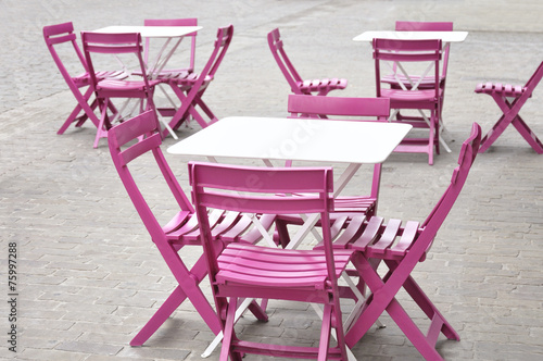 White tables and pink chairs