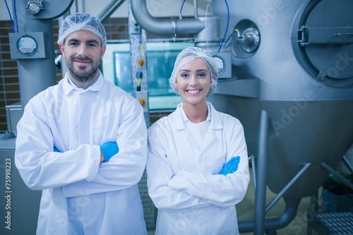 Food technicians smiling at camera