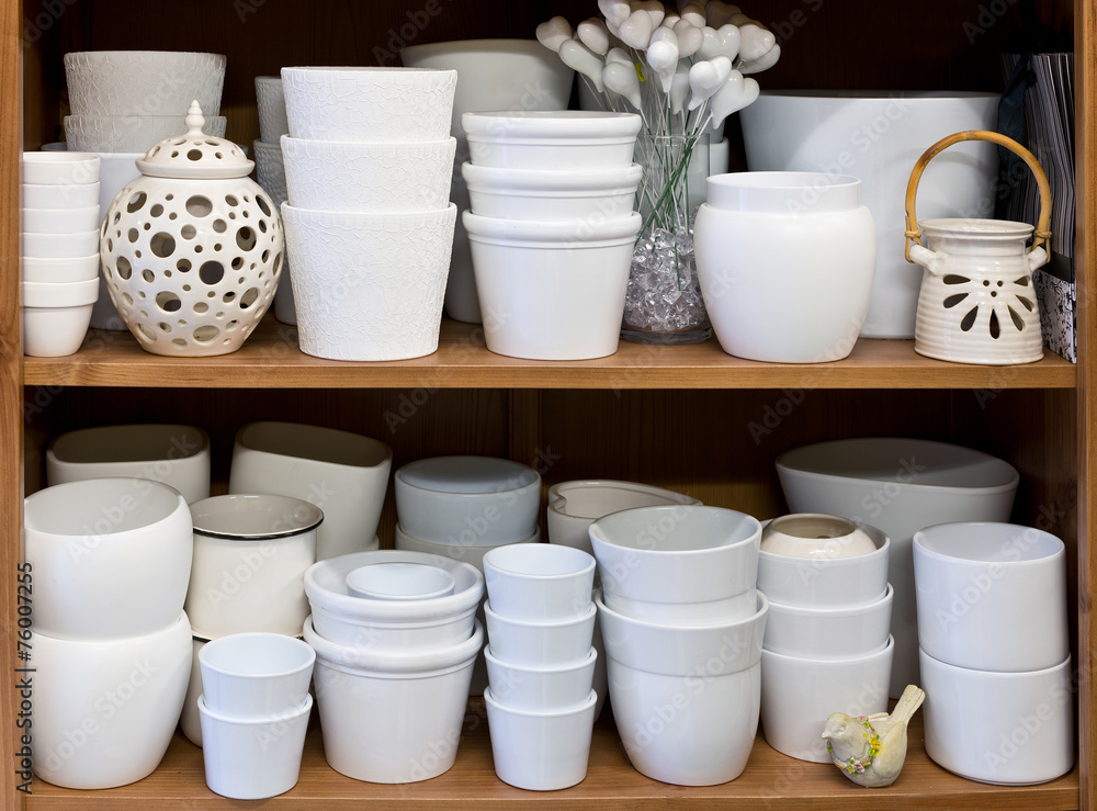 white flowerpots in the florist store white flowerpots in the florist store