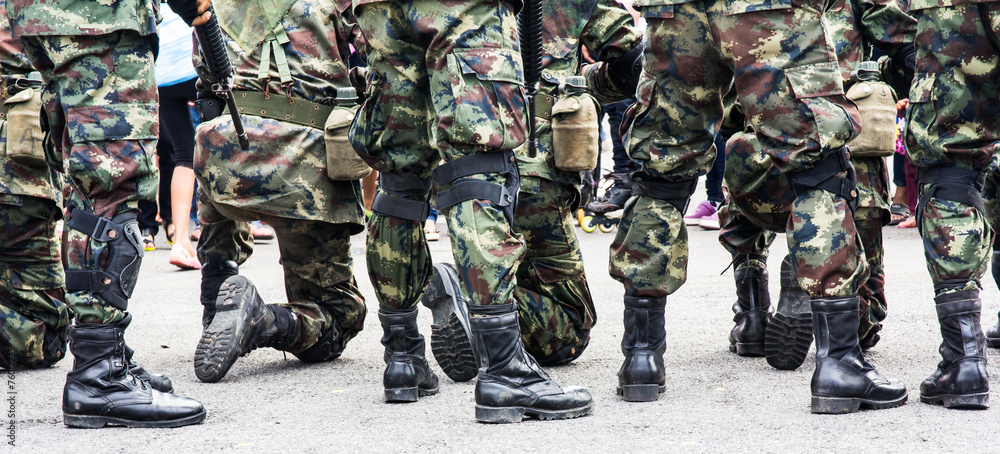 Soldier standing in defensive line .