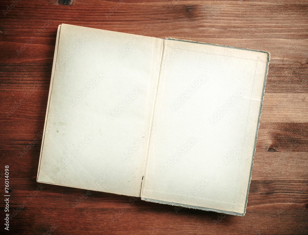 Open Book blank on old wood background Open Book blank on old wood background