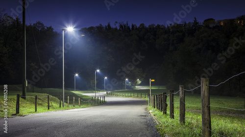Night road with curves and street lamp
